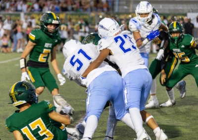 Pictured is Flashes Varsity #’s 51 & 23 putting a stop to a Simi Valley player. Final score Flashes 49 – Highlanders 3. Photo credit Crystal Gurrola.