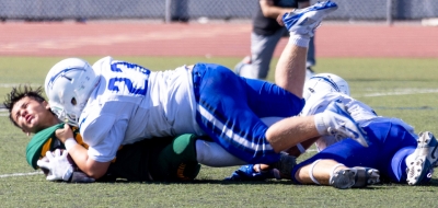 Above are a few Flashes players taking down a Highlander in this past Friday’s game. Final score Flashes 6 – Highlanders 14. Photo credit Crystal Gurrola.