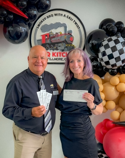 Shane Morger of Bunnin Chevrolet presenting Brandy Hollis with a Diamond Sponsorship check for the Fillmore Women’s Service Club Casino Night event coming this weekend.