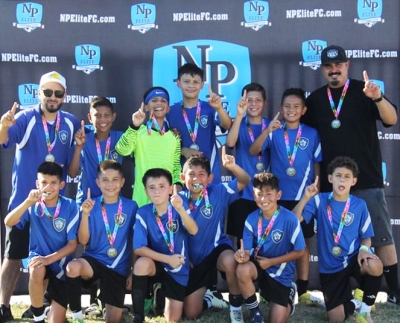 August 17 – 24th Fillmore’s California Untied FC 2013 Boys team earned the title of Champions in the NP Elite Summer Bash Tournament. Top Row: Head Coach Octavio Mejia, Julio Vargas, Obie Qualls, Joan Mendez, Jeancarlo Mendez, Julian Martinez, and Asst. Coach Victor Magana. Bottom Row: Vicente Magana, Ethan Lomeli, Antonio Guevara, Jaxon Cervantes, Aydenn Martinez, and Julian Morones. Photo credit Erika Arana, California United FC Public Relations.