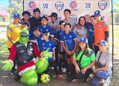 Pictured above are some of the Blue Sonic Players smiling along with the Grinch as they take a photo to end their 2024 season. Photo credit Nancy Rodriguez Hernandez.