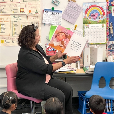 Pictured is Fillmore Unified School Board Trustee (former principal of San Cayetano) Tricia Gradias, reading to San Cayetano Elementary students.
