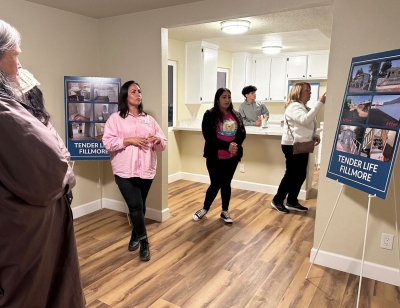 Pictured top left is House/Case Manager Brandi Brown, introducing visitors to the Tender Life program. The evening hosted an open house of the newly remodeled home and property. Photo credit Gazette Staff.