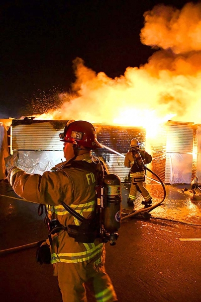 On Saturday, July 4, multiple units responded to a fire at Fillmore High School and found construction materials in the campus parking lot engulfed in flames. After several hours of batting the fire it was extinguished. Authorities are asking for tips: scan the QR code provided on page 1 to contact deputies. Photo credit Angel Esquivel.