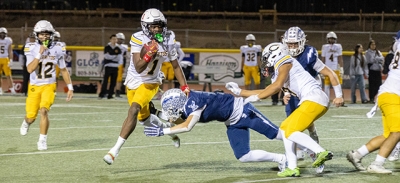 A Flashes player takes a dive to put a stop to a Cerritos player trying to make his way up the field. Photo credit Crystal Gurrola.