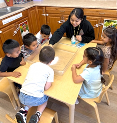 Above and below is Sierra High School senior Natalie Rodriguez working with some pre-school students as part of the new Preschool Internship Pilot Program.