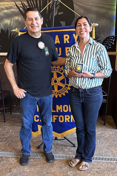 Pictured (l-r) are Rotary President John Garnica and guest speaker Laura Asenas. Photo credit Martha Richardson.