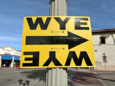 Yellow signs direct crews to filming locations.