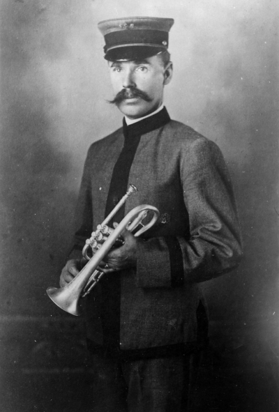 Bobby Styles holding his cornet. This may have been taken in England considering how young he looks and the uniform is not the one we have in photos of the Fillmore City Band.