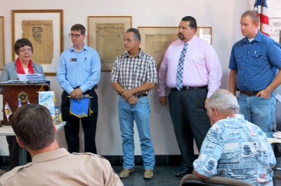 Loretta Butts, Rotary District Governor, Sean Morris, President, new members Joe Ricards, Adrian Palazuelos, and Andy Klittich.