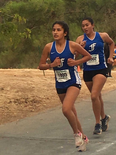 FHS teammates Isabella De La Cruz and Yakeline Magaña as they compete at the third league mini-meet to qualify for CIF
Section Division 4 Prelims. Photo courtesy Kim Tafoya.