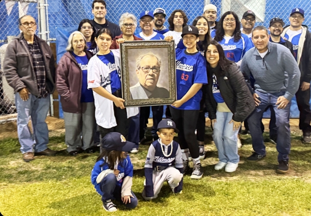 On Friday night, February 28th, Fillmore Little League (FLL) held opening ceremonies for the 2025 season. Dora Sanchez sang the National Anthem. Jack Morales in honor of his brother David “Mucho” Morales started off the season with their family on the mound and behind the plate. Teams filled up fast this season and baseball is off with a crack of the bat. Don’t forget to swing by the snack bar for the famous chili cheese fries and some FLL fan gear! Thank you FLL and all the volunteers who make this possible! Thank your umpire! Pictured above is the Morales Family with FLL board members, David’s brother Jack and family. Photo credit Brandy Hollis. More photos online at www.FillmoreGazette.com.