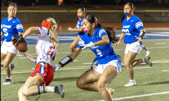 On Thursday, August 21st, Flashes Girls Flag Football hosted San Marcos High School. Both JV and Varsity teams played well but fell short to San Marcos. Above is FHS Varsity #4 reaching for a flag to stop the San Marcos player. Final score San Marcos 46 - Flashes 0. Inset, from the Flashes JV game. Final Score San Marcos 13 – Flashes 12. Fillmore will play the Highland Bulldogs Thursday, August 28th, 7:30p.m. at Home. Photo credit Crystal Gurrola.