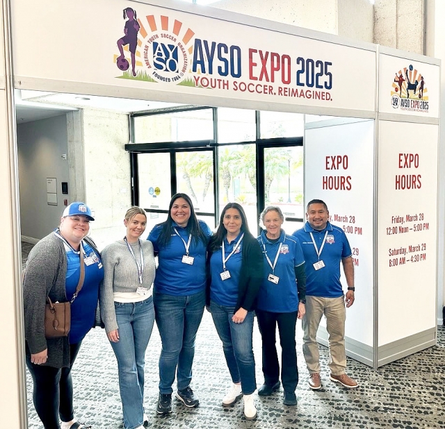 This past weekend Fillmore AYSO Region 242 attended the 2025 AYSO Sections 1/10/11 EXPO in San Diego at the event Fillmore’s AYSO’s Arnold Muñoz was honored as the AYSO Area 10W Volunteer of the Year. Above is the group of Fillmore’s AYSO members Picture above is Megan Hadley (Fillmore Region 242 Coach Admin), Marie Sasson (Fillmore Region 242 Treasurer), Crystal Cardenas (Fillmore Region 242 CVPA), Alyssa Ceballos (Fillmore Region 242 Secretary), Cindy Elliott (Fillmore Region 242 Ref Admin) and Arnold Muñoz (Fillmore Region 242 Regional Commissioner) who attended the event. Inset, is Fillmore’s Arnold Muñoz (Fillmore AYSO regional commissioner) being presented his award by Dave Howells (AYSO Area 10W Director). Photo credit Arnold Muñoz.