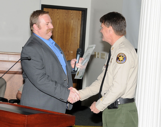 Mayor Rick Neal presents a proclamation to Big Brothers Big Sisters National Mentoring program, Commander Tim Hagel accepted the proclamation in their honor.