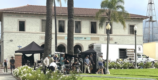 American Family Insurance was filming in Fillmore’s Central Park last week. A frisbee was being thrown in rehearsal for the shooting. Photo credit Gazette Staff.