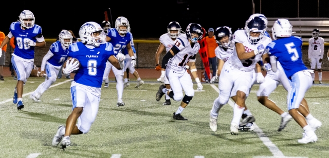 Pictured above is Fillmore’s Varsity #8 carrying the ball while teammate #5 blocks to allow him to advance up the field to gain yardage for the Flashes in their Homecoming game against Chatsworth last Friday night, September 20. Final score, Fillmore 24 - Chatsworth 6. Photo credit Crystal Gurrola. See more photos online at www.FillmoreGazette.com.