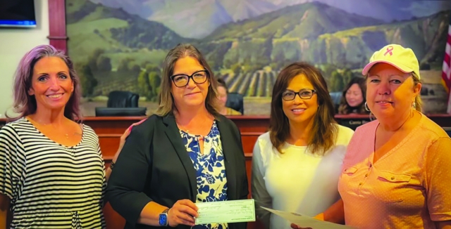 On Wednesday, July 17, the Fillmore Service Women’s Club (“FSWC”) was acknowledged by the City of Fillmore by Mayor Carrie Broggie for their support and sponsorship of the City’s Summer Music Series event. The Summer Music Series event began on July 19th and will run through August 30th on Friday evenings from 6:00 p.m. – 8:00 p.m. at Central Park Plaza. Residents and visitors are welcome to gather at the park to enjoy music by local live bands and artists. Pictured (l-r) are FSWC members Brandy Hollis, FSWC Vice President Danielle Quintana, FSWC President Carina Forsythe, and Mayor Carrie Broggie. Courtesy Carina Forsythe. Photo credit by Erika Herrera.