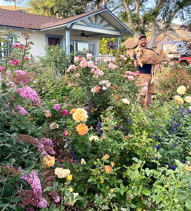 Fillmore Civic Pride volunteers have selected the 2026 âMay Yard of the Monthâ winner as Tim Klittich and his beautiful yard in the 300 block of Blaine. Avenue Pictured is Tim along with his dog, Hazy. Photo credit Linda Nunes.
