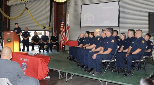 On Wednesday, July 3, 2024, the Fillmore Fire Department held a graduation ceremony for 17 individuals for the Class 11 Fillmore Fire Academy. Pictured above is Pedro Zepeda, class spokesman, addressing family, friends and other guests for the graduation class. Pictured below is Fillmore Fire’s Sal Ibarra, Fillmore Fire Chief Keith Gurrola, Pedro Zepeda and Battalion Chief Ron Ramirez presenting the Class 11 plaque. Photo credit Angel Esquivel.