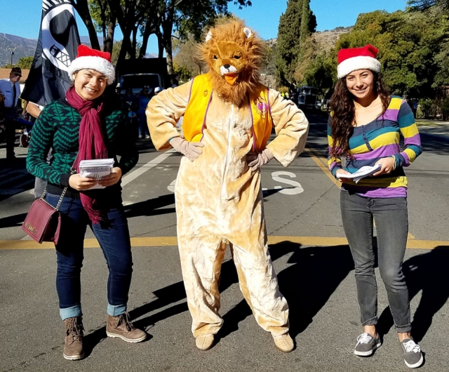 Fillmore Lions Club is proud to host the annual Christmas Parade on Saturday, December 7th at 10am. If you know of any individuals or groups who would like to participate, please go to fillmorelionsclub.org to register. Also, Santa and his elves will be near the Historical Museum (behind city hall) for families to take pictures with him free of charge immediately after the parade. For questions, email the club at fillmorecalionsclub.org or call Lion Steve at 805-904-5424. Pictured right is Leo the Lion and friends smiling at a previous Lions Club Christmas Parade. They hope to see you there this year!
