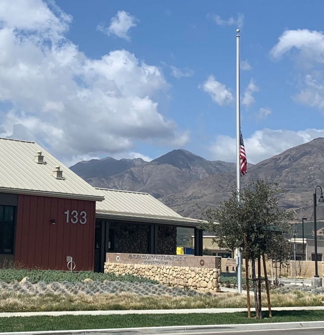 Fire station in Fillmore with flag at half-mast.