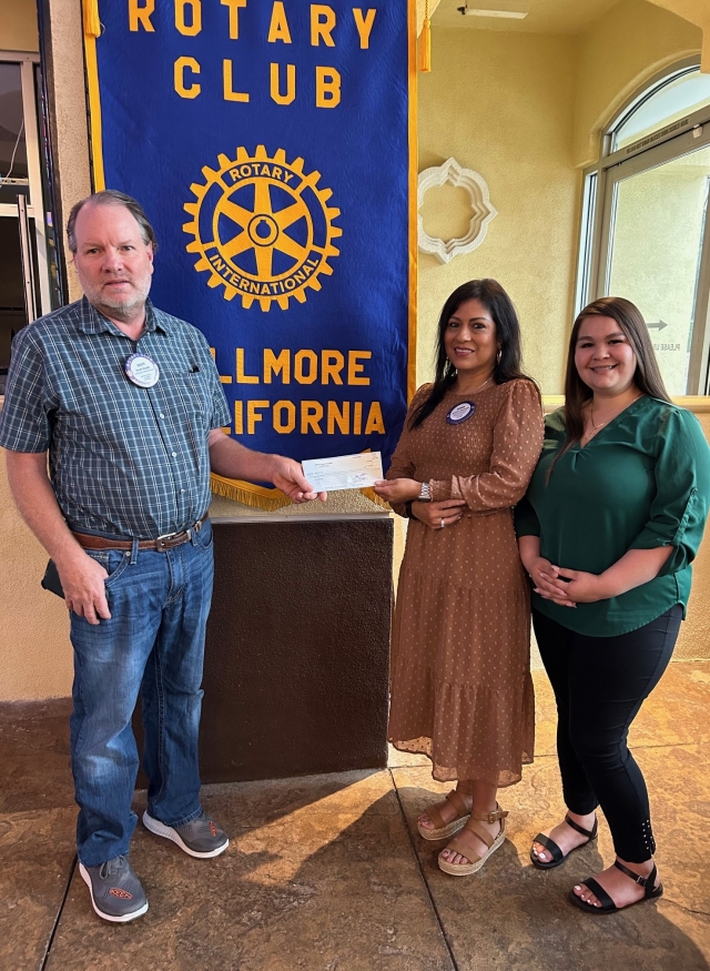 Rotary President Scott Beylik presented a check for $1,000 to Rotarian Jennie Andrade and Alina Cardenas, from Bank of Sierra for Grad Nite Live. Grad Nite Live is an event for Fillmore High Graduates. It began in 1991 and is meant to keep the students safe on graduation night, while having a great celebration. This year the students will be bused to Universal Studios for which they pay a fee, but most of the cost is from donations such as this. Pictured (l- r) are President Scott Beylik, Rotarian Jennie Andrade and Alina Cardenas. Photo credit Martha Richardson. 