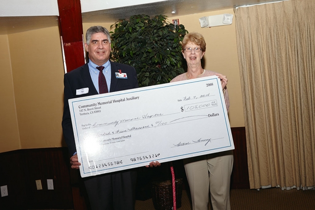 CMHS President & CEO, Gary Wilde receives a $105,000 donation check from CMH Auxiliary Treasurer Carol Torsney.