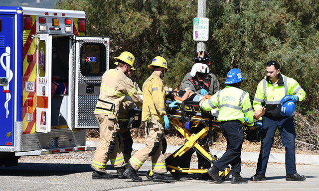 On Thursday, September 3, at approximately 9:47 a.m., the Ventura County Fire Department, AMR Paramedics, and the California Highway Patrol were dispatched to a traffic collision in the 3500 block of Grimes Canyon Road. According to CHP, the incident involved a blue sedan that struck an embankment and rolled over. Due to the driver’s injuries, a helicopter was requested. The patient was transported to the nearest helistop, where Copter 9 airlifted the patient and transported them to a local hospital. Southbound lanes of Grimes Canyon Road were temporarily shut down while emergency crews operated at the scene. A tow truck was requested to remove the vehicle. The cause of the collision is under investigation. Photo credit Angel Esquivel.