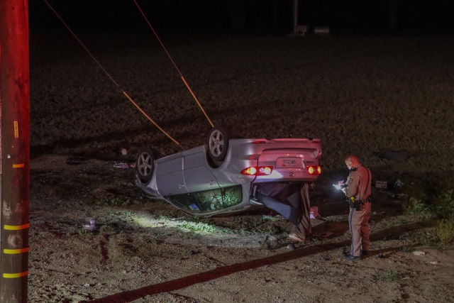 On Friday, April 21, 2023, at 1:40am, Ventura County Fire Department and AMR Paramedics were dispatched to a reported vehicle accident eastbound SR126 & Camino Del Rio, Piru, just east of the LA County line. Arriving firefighters reported a single vehicle on its roof approximately 30 -feet off the roadway with one female patient laying on the ground. Firefighters and paramedics were able to treat the patient who was transported to a local hospital, condition unknown. Cause of the single vehicle crash is under investigation by Moorpark-CHP Office. Photo credit Angel Esquivel-AE News.
