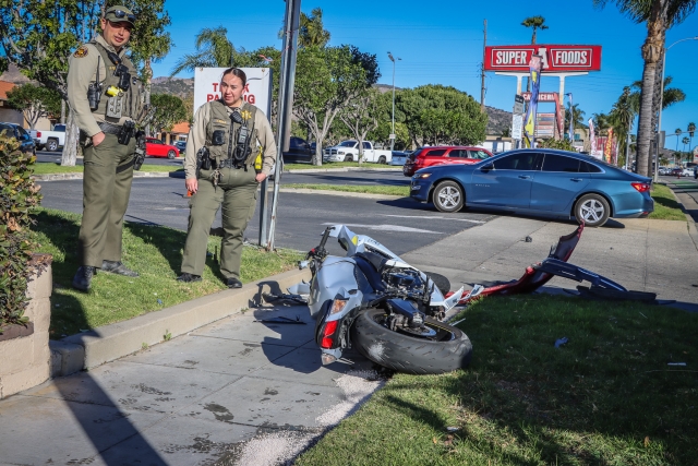 On Thursday, January 9th, at 2:11 p.m., the Fillmore Police Department, Fillmore Fire Department, and AMR Paramedics responded to a reported vehicle versus motorcycle collision on Ventura Street in front of Super A Foods. Arriving deputies found the rider on the ground. The driver of the vehicle remained on scene and cooperated with deputies. AMR paramedics treated the rider, who was transported to a local hospital, condition unknown. An additional ambulance was also requested for the driver of the vehicle, who eventually refused medical treatment. Photo credit Angel Esquivel.