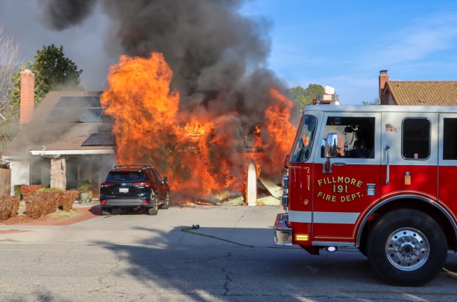 On Saturday, February 1, 2025, at 3:48 p.m., Fillmore Fire Department, Ventura County Fire Department, AMR Paramedics, and Fillmore Police Department responded to a structure fire in the 800 block of Central Avenue. Firefighters arrived to find a garage completely engulfed in flames. Firefighters were able to extinguish the fire with the help of nearby fire departments. A burned-out vehicle was also discovered in the garage. Fillmore Fire Chief Gurrola reported that the fire was completely extinguished by 5:00 p.m. Fillmore Deputies closed a portion of Central Avenue; no injuries were reported, and a Fillmore Fire investigator was dispatched. The house residents were displaced, and the American Red Cross was at the scene assisting the family. Photo credit Angel Esquivel.
