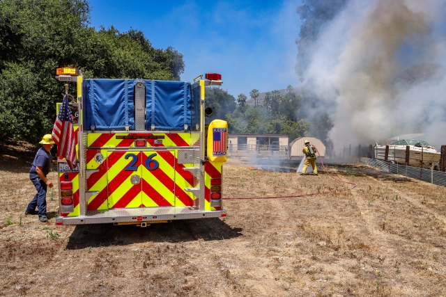 On Thursday, June 20, at 11:38 a.m., the Ventura County Fire Department and surrounding fire stations responded to a boat fire in the 1600 block of Grand Avenue. Arriving firefighters discovered a boat on fire, as well as dry grass blazing in the next-door backyard property. Firefighters on the scene extinguished the fire in minutes. Ventura County Fire investigators were also sent; cause is under investigation.
Photo credit: Angel Esquivel-Firephoto_91
