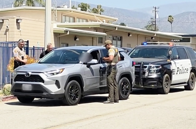 U.S. Immigration and Customs Enforcement (ICE) agents were parked at the Fillmore Sheriff’s station on Tuesday after being followed aggressively by a female driver on Highway 126, including the use of a PA system installed in her car. The woman is shown parked behind the federal agents’ car; inset, agents speaking with the female driver. Two weeks ago, a woman who identified with VC Defensa followed and harassed a private citizen, believing he was ICE. The incident was reported to the Fillmore Police Department. A witness to the incident said the woman also identified herself with VC Defensa. False “sightings” of agents have also been posted on Facebook, when Sheriff Deputies serving warrants/probation searches are observed. Photo credit Sebastian Ramirez.