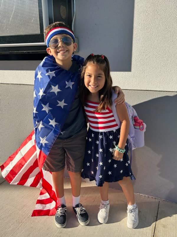 Last week, Mountain Vista Elementary celebrated Patriot Day in honor of the 23rd Anniversary of the September 11th attacks on the Twins Towers. Above ae few students showing their patriotic spirit wearing Red, White & Blue. Photo courtesy https://www.facebook.com/permalink.php?story_fbid=pfbid0y4wTU8Lagt9kCczUxyrn8M5nwUNEriYnpNGmCv1P34dAafrEPSZWyYJ8Edr9kon6l&id=100063493185283.
