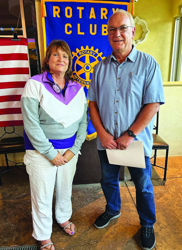 At last weekâs Rotary Club of Fillmore meeting, President Anna Reilley inducted new member Gary Cushing into the club. Photo Credit Martha Richardson.