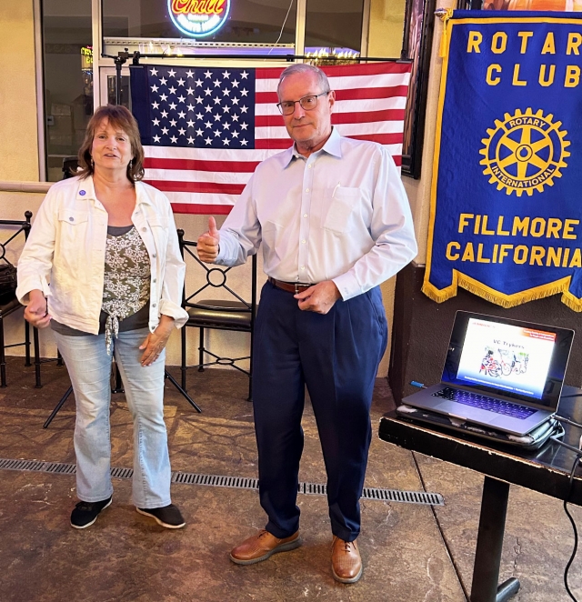 At last Wednesday’s Fillmore Rotary Club meeting President Anna Reilley presented Kyle Wilson with a Rotarian of the Month pin for his work on the Olympic Athlete Fundraiser. Each member chose athletes they wanted to watch in the Olympics. The better they did the more was donated to the Club. Photo credit Martha Richardson.