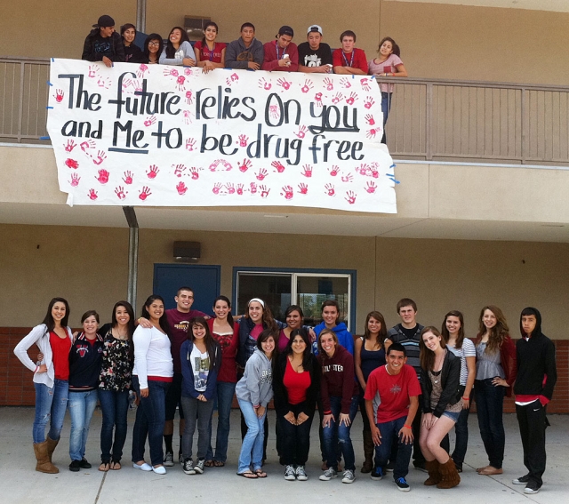 Fillmore High School has been buzzing with activity lately as they prepare for Santa Paula Week and support Red Ribbon week . This week is national Red Ribbon Week and their theme for this year is “The future relies on you and me to be drug free.” ASB made the poster with the new slogan and handprints from the members to symbolize their dedication to the drug free cause. To get students involved and aware of the events, they are holding fun noontime activities relating to National Red Ribbon Week and Dress Up Days. In upcoming events at FHS, they are holding a Blood Drive on campus, Nov. 1st, and Santa Paula Week begins November 7th.