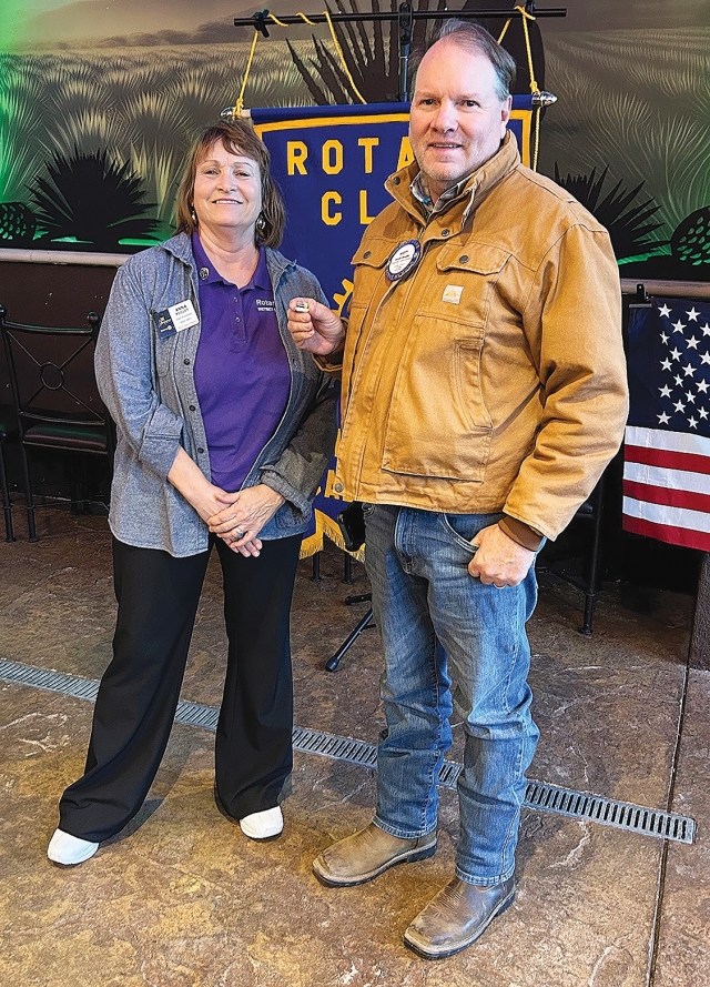 At last week’s Fillmore Rotary Club meeting President Anna Reilley presented Scott Beylik with a Rotarian of the Month pin for all he does for the Club. Photo credit Martha Richardson.