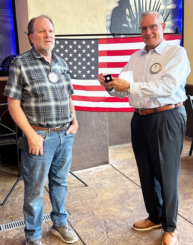 At last week’s Fillmore Rotary Club meeting President Scott Beylik presented Rotarian Kyle Wilson with his third Paul Harris Award. This comes from the Rotary Foundation for the continuing donations he has given to the Foundation. Money from the Foundation is given to Clubs for special projects. Kyle also informed the Club that it’s time for our Football Pool. Each member chooses a favorite team and will pay a certain amount for wins or losses. This money also goes to the Foundation. Photo credit Martha Richardson.