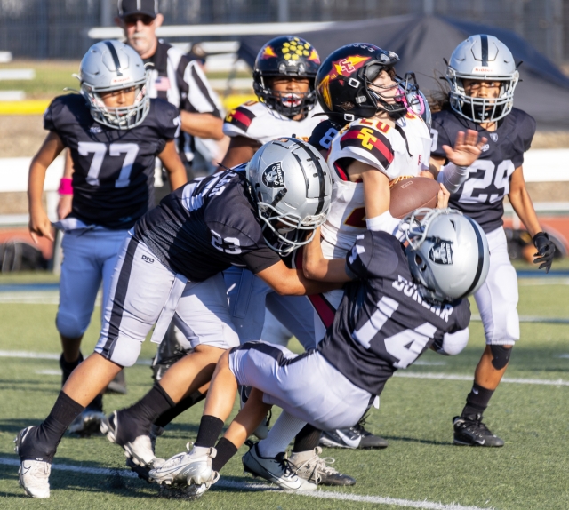 Pictured are Fillmore Raiders Sophomores Black teaming up to make the tackle against the Warriors in last Saturday’s game. Final score Raiders 6 – Santa Clarita 0.