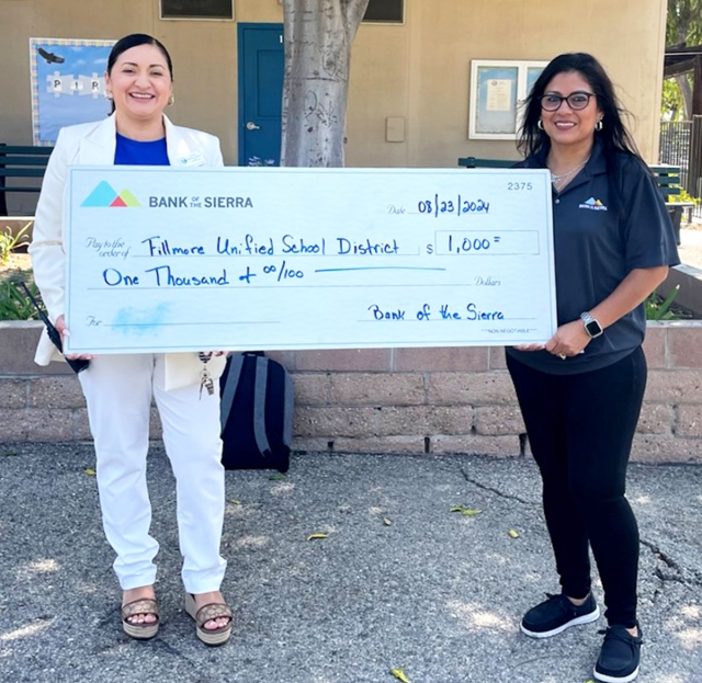 Piru Elementary students would like to give a big thank you to Bank of the Sierra for their generous $1,000 donation of backpacks and their thoughtful contribution to our schools at Fillmore USD! Your support means the world to us, and we are truly grateful for your kindness. Together, we are making a difference! Pictured is Piru Principal Viviana Magaña-Laureano with Bank of Sierra representative Jennie Andrade presenting the check to the school. Courtesy https://www.blog.fillmoreusd.org/piru-elementary-condors-blog/2024/8/23/thank-you-bank-of-the-sierra-for-your-donation.