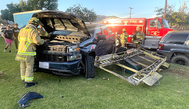 On Thursday, July 23, at 7:22 p.m., the Fillmore Police Department, Fillmore City Fire Department, and AMR Paramedics were dispatched to a reported traffic collision at the intersection of Los Serenos Drive and El Paseo Street. Upon arrival, deputies located a pickup truck that had collided with a parked trailer attached to a parked vehicle. No injuries were reported, and the cause of the collision is under investigation. Photo credit Angel Esquivel.