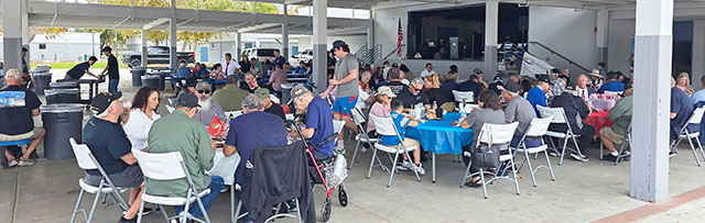 Following the Veterans Day Parade a luncheon was held at Fillmore Middle School. The Annual Veterans Day Ceremony began at 1:30 p.m. This year’s speaker was Fillmore City Councilman and U.S. Navy Veteran John Garnica, who shared a reflection on service, sacrifice, and community. The event remains one of Fillmore’s most cherished traditions, uniting generations in gratitude and remembrance. This year’s event served 130 people. Inset, a volunteer serving the meals of gratitude. Photo credit Sebastian Ramirez.