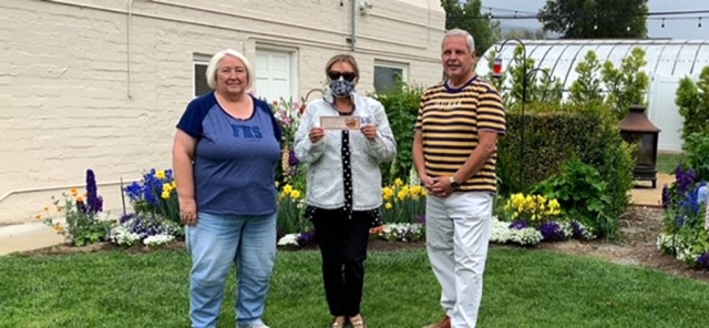(l-r) Corinna Mozley, Fillmore High School Alumni Vice President and Ari Larson, Fillmore City Council Member, presenting FHS Alumni President Mark Ortega with a certificate from Otto & Sons Nursery for being selected March 2021 Yard of the Month. Photos Courtesy Matt Mozley.