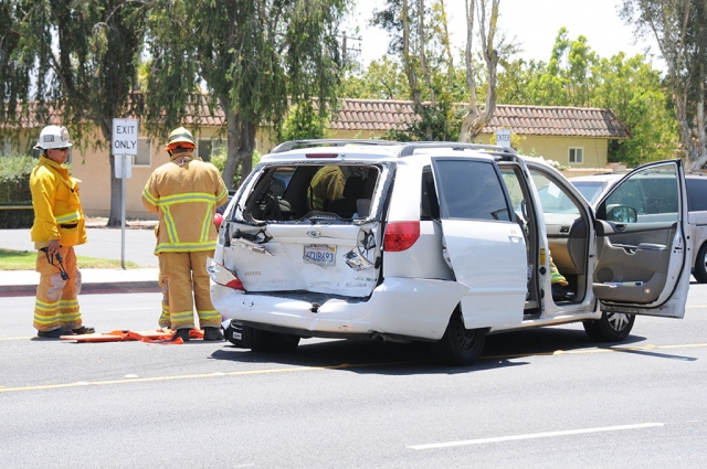 On Saturday, at approximately 1:15 p.m., a collision between a small pickup truck and a van occurred on Highway 126 near A Street.. The truck struck the rear end of the van causing considerable damage. The female driver of the van was taken away by ambulance. The extent of her injuries were not reported.