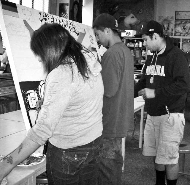 The 11th Annual Fillmore High School Arts Show is coming up April 14th. Art students (l-r) Tanya Arana, Manuel Bichayada, and Nathan Ibarra are working on a large canvas for the show.