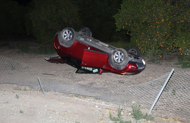 On Sunday, May 23, 2021, at 10:10pm, Ventura County Sheriffs, Fillmore City Fire (ME191 R91), and AMR paramedics were dispatched to a vehicle vs fence. On arrival sheriff deputies found an overturned vehicle located at Goodenough Road and A Street. The driver apparently lost control on the curve and crashed into the fence, landing on its roof in an orchard. The driver was not injured and was able to get out before fire crews were on-scene. No other vehicle was involved. Photos courtesy Angel Esquivel-AE News.