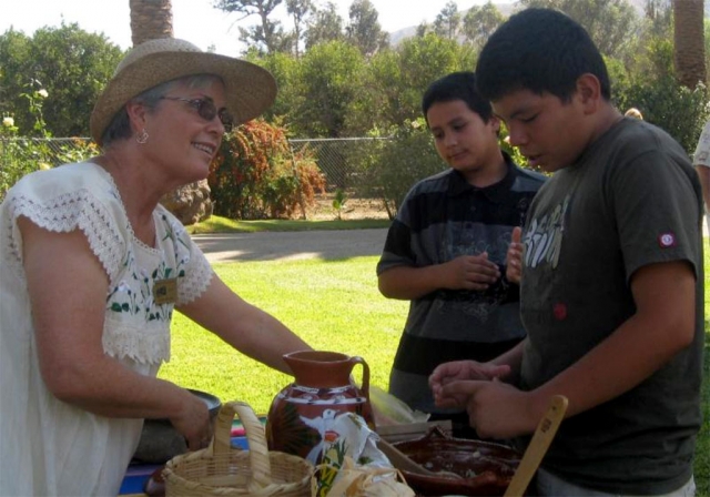 Rancho Camulos Museum docent Carmen Zermeno teaches young visitors about 19th century tortilla making, a primary staple in feeding rancho families, workers and guests.