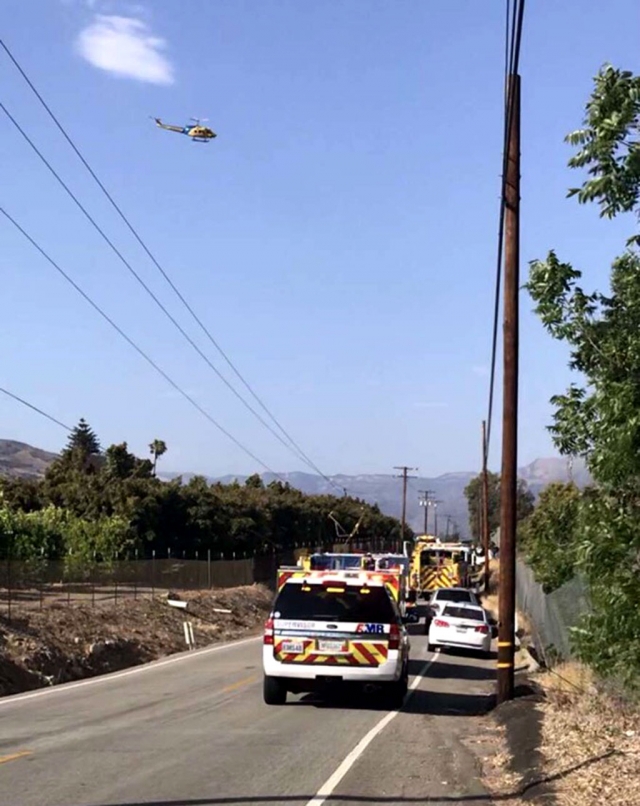 On Sunday, May 30, 2021, at 4:46pm, the Ventura County Fire Department, CHP, and AMR Paramedics were dispatched to a heavy traffic collision in the area of Sycamore Road, north of Highway 126. Arriving on scene fire crews reported a 2015 Nissan Altima travelling eastbound on Sycamore had severed a utility pole, with wires down. One person was reported in the roadway with another person trapped inside the vehicle. Fire crews were able to extricate the person trapped in the vehicle; the person in the roadway was declared deceased. He has been identified as David Brown, 39, of Fillmore, a former volunteer Fillmore Firefighter until 2017. A VCSO helicopter was also in the area but was canceled by fire crews once ambulance transport made patient condition unknown. Ventura County Sheriff ’s Department units were also on scene. CHP shut down Sycamore & 7th Street/Hwy 126 & Sycamore until 8:00pm. Photos courtesy Angel Esquivel-AE News.